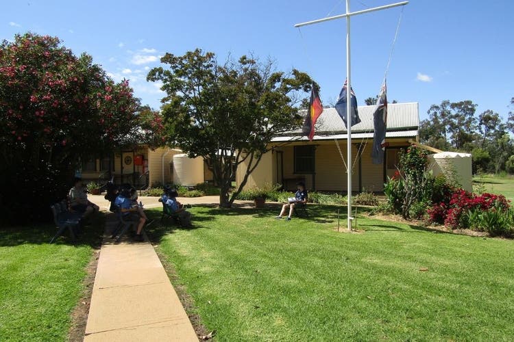 Our school students are participating in a community event in our front yard space, it is a welcoming scene for visitors at our school.